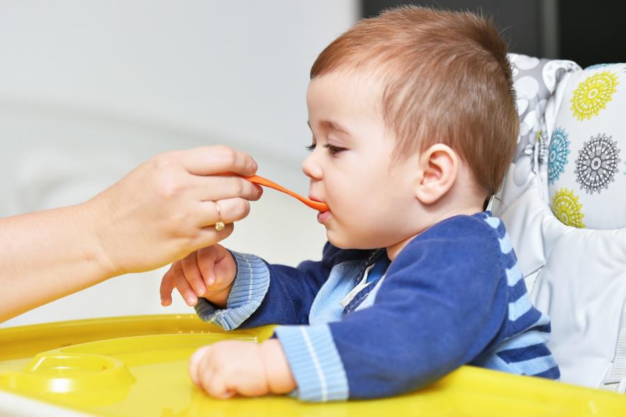 Baby eating from a spoon